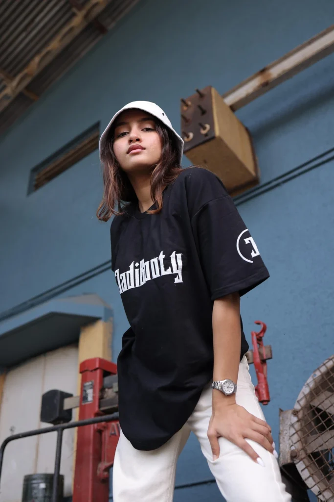 Model wearing a black oversized tee, showcasing our high-quality custom t-shirt printing for local streetwear brands in Malaysia.