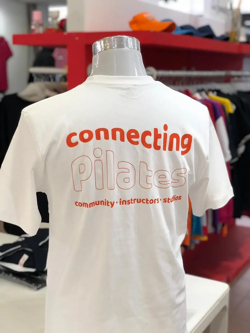 A modern custom made uniform styled as a premium oversized t-shirt, featuring high-quality custom printing for a corporate event in kuala lumpur, malaysia.